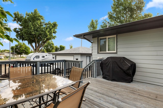 305 S Dell Dr, Havre, MT 59501 - wooden deck with outdoor dining area and a grill