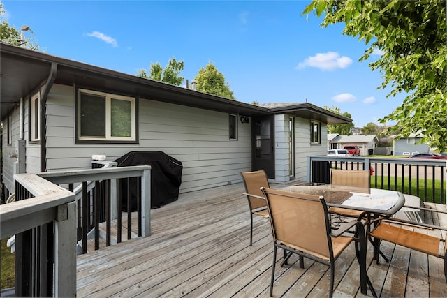305 S Dell Dr, Havre, MT 59501 - wooden deck with grilling area and outdoor dining space