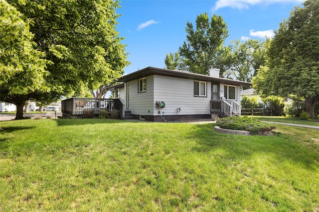 305 S Dell Dr, Havre, MT 59501 - view of front facade with a chimney, a front lawn, and a deck