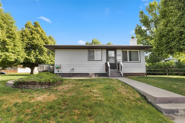305 S Dell Dr, Havre, MT 59501 - single story home with a chimney