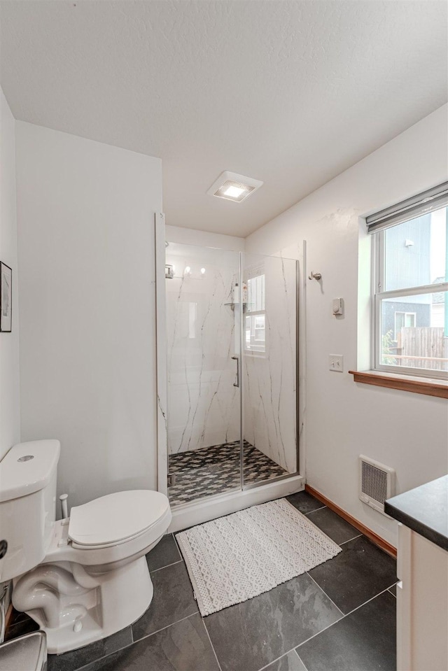 620 Phillips St Unit B, Missoula, MT 59802 - full bathroom with a marble finish shower, healthy amount of natural light, vanity, and a textured ceiling