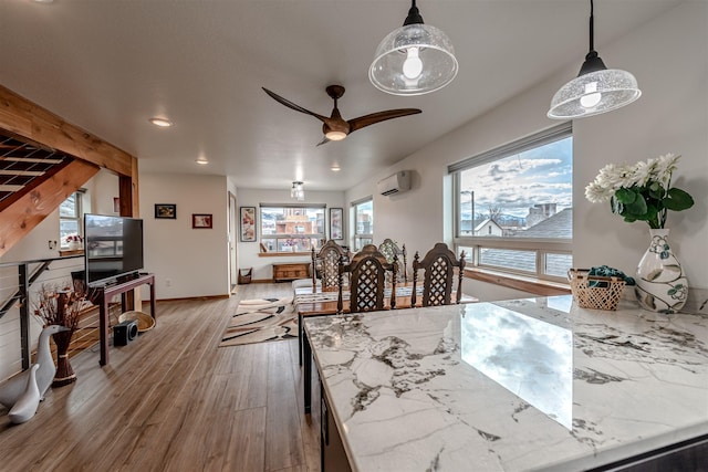 620 Phillips St Unit B, Missoula, MT 59802 - dining area featuring a wall unit AC, wood finished floors, a ceiling fan, and recessed lighting
