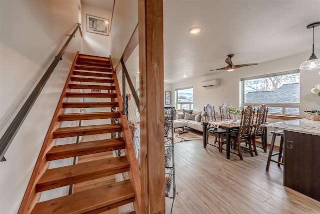 620 Phillips St Unit B, Missoula, MT 59802 - stairway with a ceiling fan, plenty of natural light, a wall mounted air conditioner, wood finished floors, and recessed lighting
