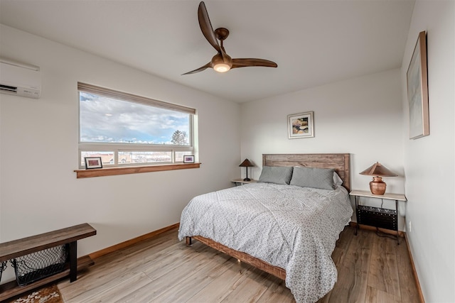620 Phillips St Unit B, Missoula, MT 59802 - bedroom featuring wood finished floors, a wall mounted air conditioner, and ceiling fan