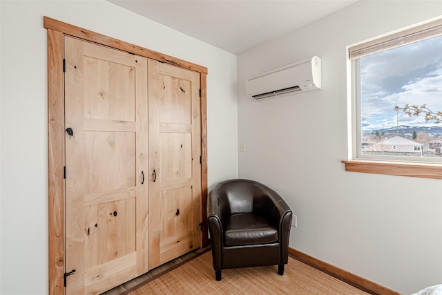 620 Phillips St Unit B, Missoula, MT 59802 - living area featuring a wall unit AC and light wood-style floors