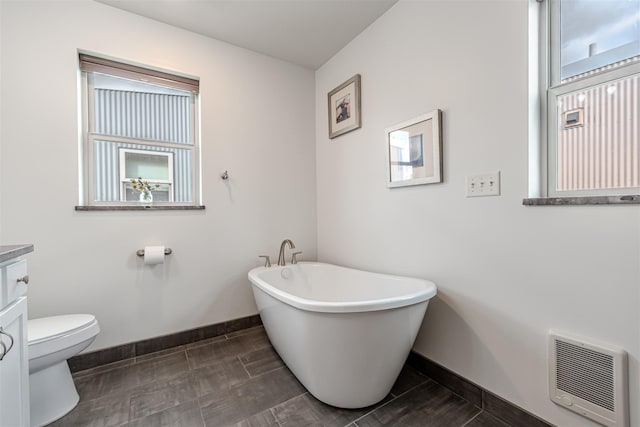620 Phillips St Unit B, Missoula, MT 59802 - bathroom with a soaking tub, vanity, and heating unit