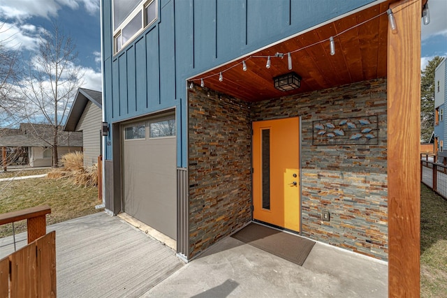 620 Phillips St Unit B, Missoula, MT 59802 - view of exterior entry featuring board and batten siding and an attached garage