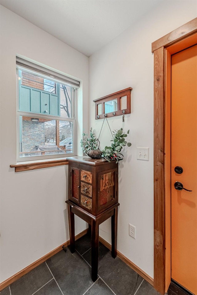 620 Phillips St Unit B, Missoula, MT 59802 - doorway to outside featuring baseboards