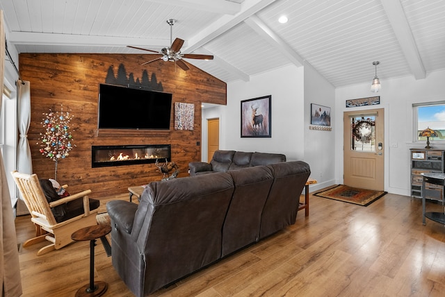 9 Blue Stem Way, Three Forks, MT 59752 - living room featuring a ceiling fan, wood finished floors, a fireplace, and wooden ceiling