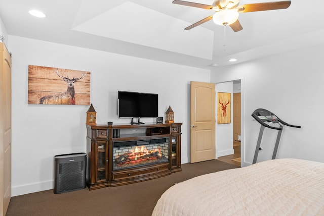 9 Blue Stem Way, Three Forks, MT 59752 - carpeted bedroom with recessed lighting, a tray ceiling, and a ceiling fan