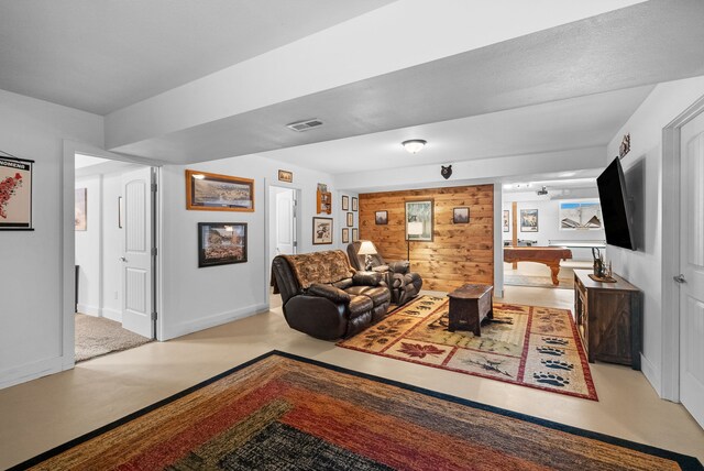 9 Blue Stem Way, Three Forks, MT 59752 - living room featuring finished concrete floors and wooden walls