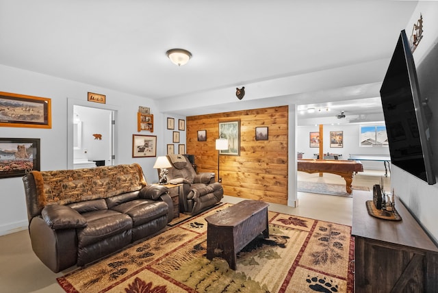 9 Blue Stem Way, Three Forks, MT 59752 - living room featuring wooden walls, billiards, and finished concrete flooring