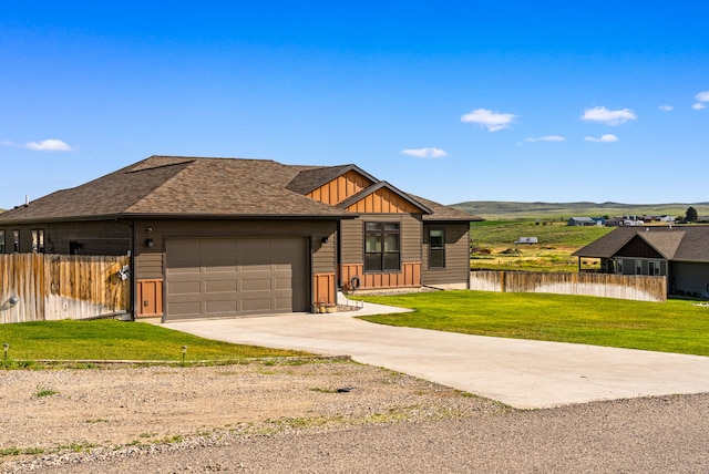 9 Blue Stem Way, Three Forks, MT 59752 - view of front of property with board and batten siding, a garage, driveway, a water view, and a shingled roof