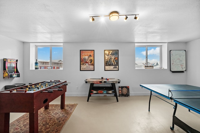 9 Blue Stem Way, Three Forks, MT 59752 - rec room featuring a textured ceiling and finished concrete flooring