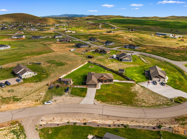 9 Blue Stem Way, Three Forks, MT 59752 - aerial view of property's location with a mountainous background and nearby suburban area