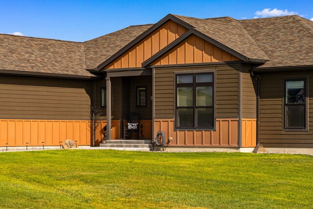 9 Blue Stem Way, Three Forks, MT 59752 - view of front of property with roof with shingles, board and batten siding, and a front yard