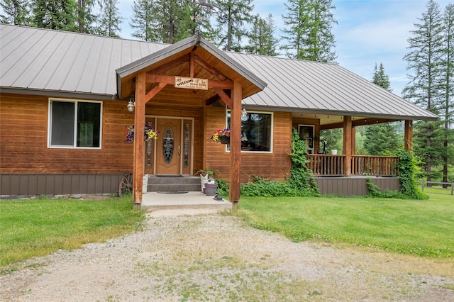 6611 Packer Creek Rd, Haugan, MT 59842 - view of front of home with a front lawn and a metal roof