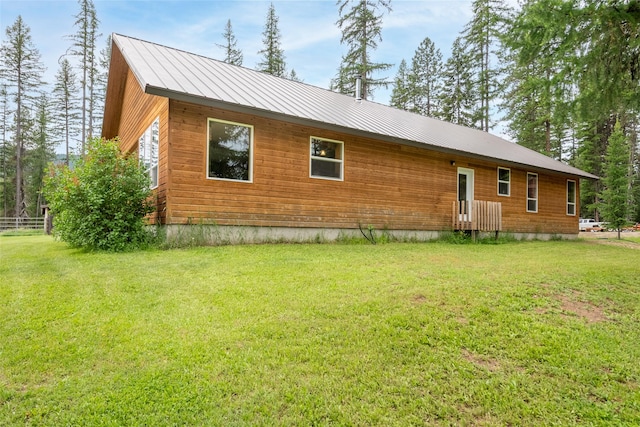 6611 Packer Creek Rd, Haugan, MT 59842 - view of front of house featuring a front lawn and a metal roof
