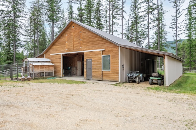 6611 Packer Creek Rd, Haugan, MT 59842 - view of front of property with an outdoor structure, an outbuilding, and a detached garage