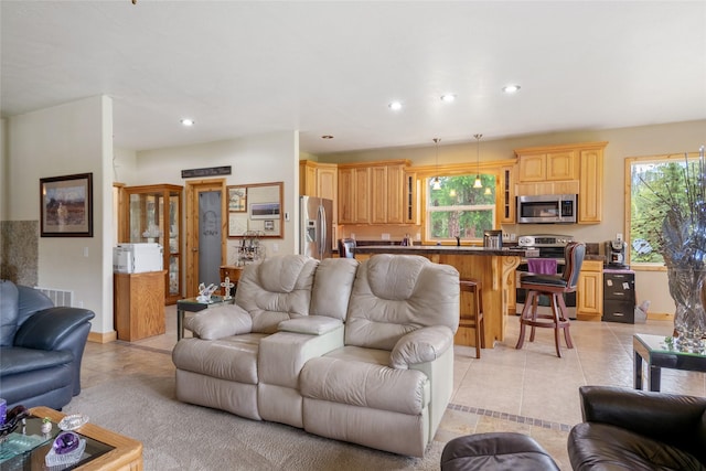 6611 Packer Creek Rd, Haugan, MT 59842 - living room featuring light tile patterned floors, healthy amount of natural light, and recessed lighting