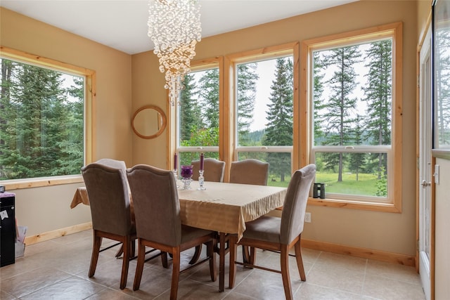 6611 Packer Creek Rd, Haugan, MT 59842 - dining space featuring plenty of natural light, a chandelier, and light tile patterned flooring
