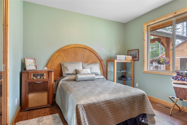 6611 Packer Creek Rd, Haugan, MT 59842 - bedroom with wood finished floors and baseboards