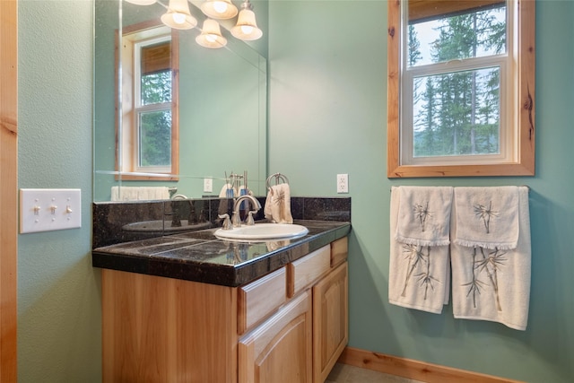 6611 Packer Creek Rd, Haugan, MT 59842 - bathroom with vanity and a textured wall