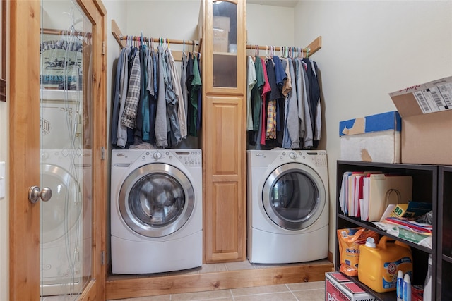 6611 Packer Creek Rd, Haugan, MT 59842 - laundry area featuring washer / dryer and tile patterned flooring