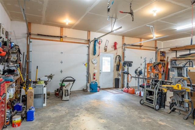 6611 Packer Creek Rd, Haugan, MT 59842 - garage featuring a workshop area