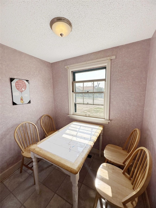 214 2nd Ave SW, Cut Bank, MT 59427 - dining area with a textured ceiling and tile patterned flooring