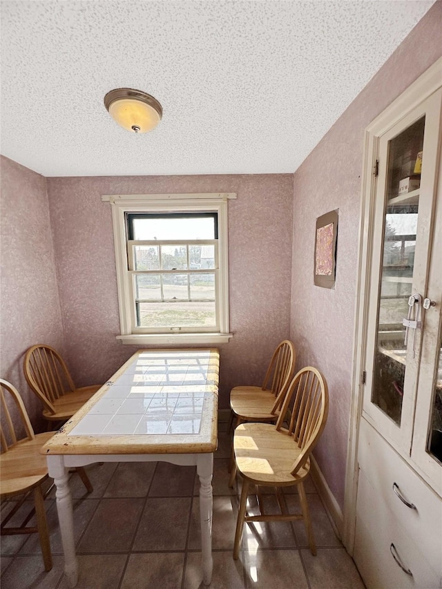 214 2nd Ave SW, Cut Bank, MT 59427 - tiled dining room with a textured ceiling and a textured wall