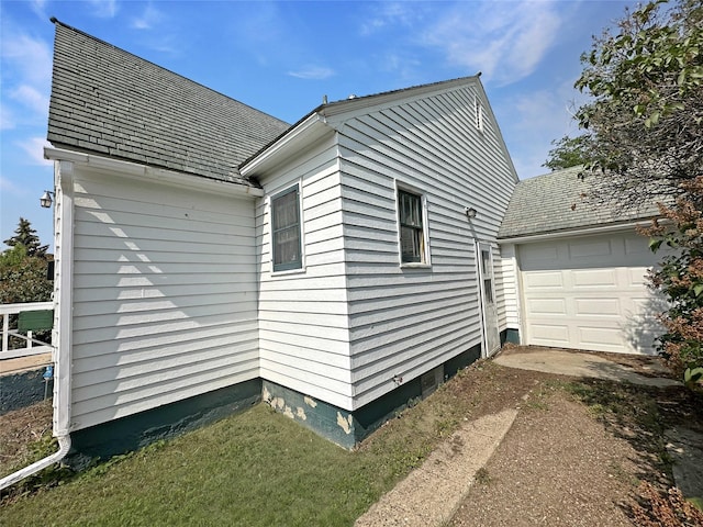 214 2nd Ave SW, Cut Bank, MT 59427 - view of property exterior featuring roof with shingles and driveway