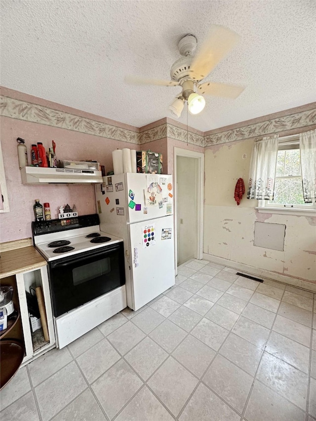 214 2nd Ave SW, Cut Bank, MT 59427 - kitchen featuring white appliances, under cabinet range hood, a textured ceiling, a ceiling fan, and light tile patterned flooring