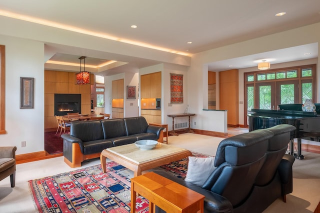 6601 Russian Joe Rd, Missoula, MT 59802 - living room with recessed lighting, plenty of natural light, a raised ceiling, and a tile fireplace