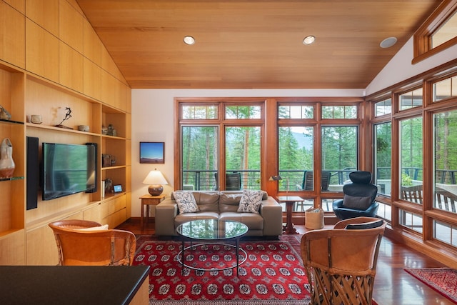 6601 Russian Joe Rd, Missoula, MT 59802 - living area featuring lofted ceiling, built in features, plenty of natural light, wood ceiling, and wood finished floors