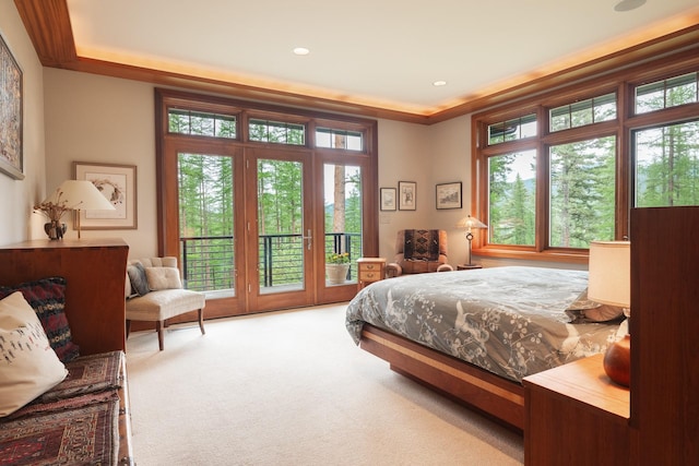 6601 Russian Joe Rd, Missoula, MT 59802 - carpeted bedroom featuring access to outside, multiple windows, and crown molding