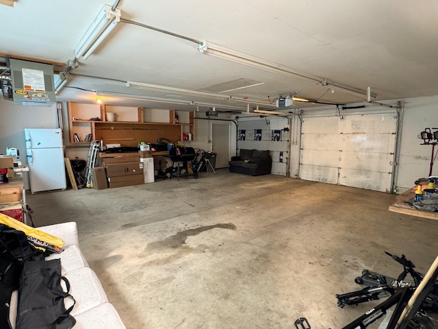 2527 1st Ave S, Great Falls, MT 59401 - garage with freestanding refrigerator and a garage door opener