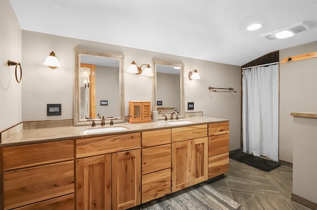704 43rd St N, Great Falls, MT 59405 - full bath featuring double vanity, curtained shower, and lofted ceiling