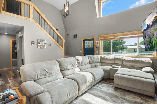 704 43rd St N, Great Falls, MT 59405 - living area with high vaulted ceiling, wood finished floors, stairway, and healthy amount of natural light
