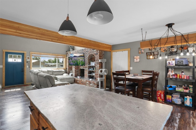 704 43rd St N, Great Falls, MT 59405 - dining space featuring wood finished floors and a brick fireplace
