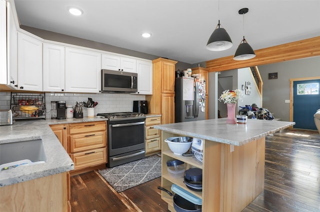 704 43rd St N, Great Falls, MT 59405 - kitchen with appliances with stainless steel finishes, backsplash, dark wood-type flooring, open shelves, and hanging light fixtures
