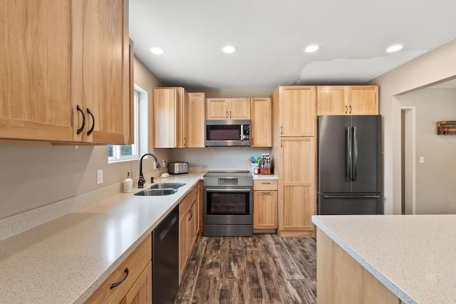 2150 Teal Dr, Kalispell, MT 59901 - kitchen with stainless steel appliances, light brown cabinetry, dark wood finished floors, and recessed lighting