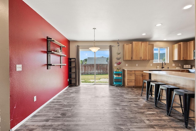 2150 Teal Dr, Kalispell, MT 59901 - kitchen with dark wood-style flooring, light countertops, healthy amount of natural light, a textured wall, and recessed lighting