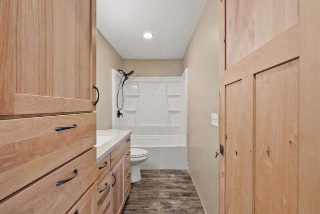 2150 Teal Dr, Kalispell, MT 59901 - bathroom featuring wood finished floors, vanity, shower / bath combination, and recessed lighting