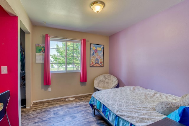 2150 Teal Dr, Kalispell, MT 59901 - bedroom with wood finished floors and baseboards