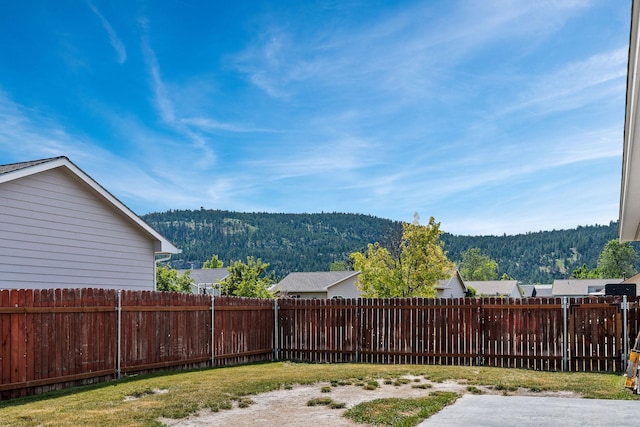 2150 Teal Dr, Kalispell, MT 59901 - fenced backyard with a mountain view