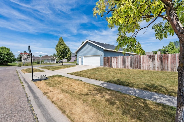 2150 Teal Dr, Kalispell, MT 59901 - view of side of home featuring driveway and a garage