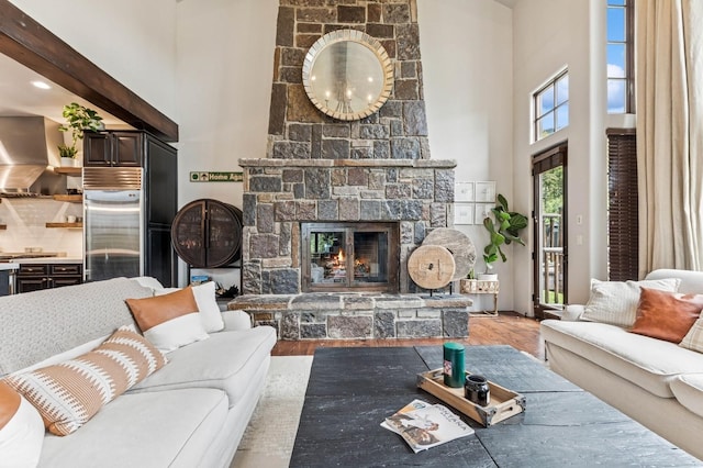 153 Slopeside Dr Unit 14, Whitefish, MT 59937 - living area with a towering ceiling, wood finished floors, and a fireplace