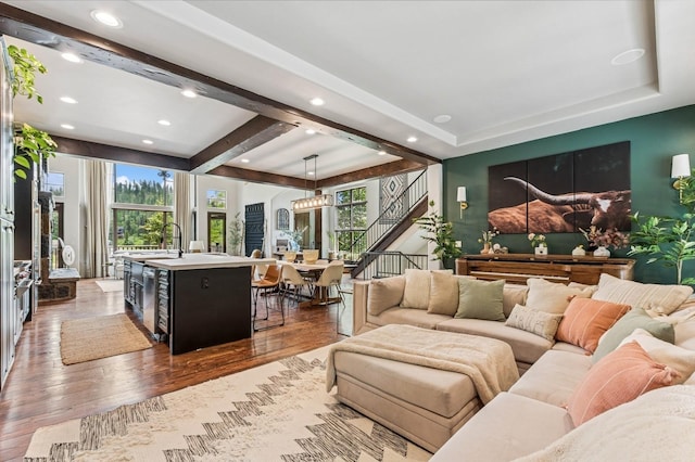 153 Slopeside Dr Unit 14, Whitefish, MT 59937 - living area with dark wood-type flooring, recessed lighting, beamed ceiling, and a chandelier