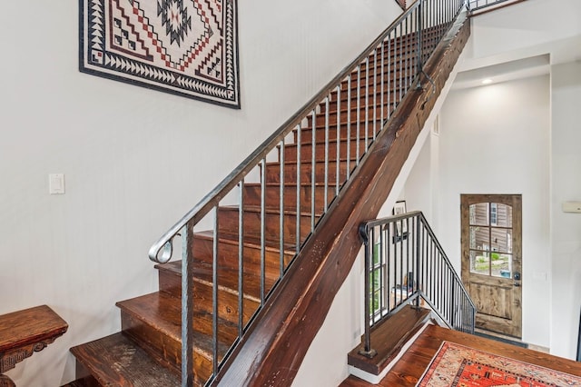 153 Slopeside Dr Unit 14, Whitefish, MT 59937 - staircase with a high ceiling and wood finished floors